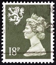 UNITED KINGDOM - CIRCA 1987: A stamp printed in United Kingdom shows Queen Elizabeth II and Royal Arms of Scotland, circa 1987.