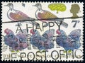 Stamp printed by UK shows French Hens, Turtle Doves and Partridge, Pear Tree, Christmas 1977 Royalty Free Stock Photo