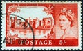 UNITED KINGDOM - CIRCA 1955: A stamp printed in United Kingdom shows Caernarfon castle and queen Elizabeth II, circa 1955.