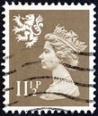 UNITED KINGDOM - CIRCA 1981: A stamp printed in United Kingdom shows Queen Elizabeth II and Royal Arms of Scotland, circa 1981.
