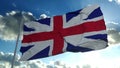 United Kingdom flag blowing in the wind in slow motion against a clear blue sky. 3d rendering Royalty Free Stock Photo