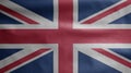 United Kingdom flag waving in the wind. Close up of Britain banner blowing soft and smooth silk. Cloth fabric texture ensign