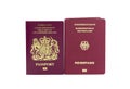United Kingdom and German biometric passports on a white background Royalty Free Stock Photo