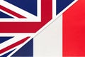 United Kingdom vs France national flag from textile. Relationship between two european countries Royalty Free Stock Photo
