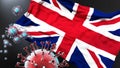 United Kingdom of Great Britain and Northern Ireland and the covid pandemic - corona virus attacking its national flag to Royalty Free Stock Photo