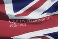 UNITED KINGDOM, SEPTEMBER - 8, 2022: The flag with text Queen Elizabeth II and year of death. 3d rendering.