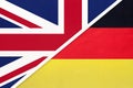 United Kingdom vs Germany national flag from textile. Relationship between two european countries Royalty Free Stock Photo