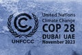 The United Nations Flag, logo of Climate Change UNFCCC on a grungy cracked wall. COP 28 Dubai, UAE