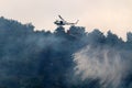 A United Nations helicopter extinguishes a fire on the Israel-Lebanon border Royalty Free Stock Photo