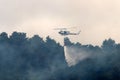 A United Nations helicopter extinguishes a fire on the Israel-Lebanon border Royalty Free Stock Photo