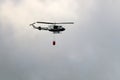 A United Nations helicopter extinguishes a fire on the Israel-Lebanon border Royalty Free Stock Photo