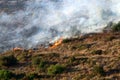 A United Nations helicopter extinguishes a fire on the Israel-Lebanon border Royalty Free Stock Photo