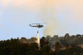 A United Nations helicopter extinguishes a fire on the Israel-Lebanon border