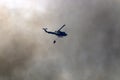 A United Nations helicopter extinguishes a fire on the Israel-Lebanon border