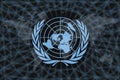 United Nations logo, on a black background with world map and network. The concept of helping the world Royalty Free Stock Photo