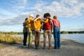 United by Nature: Friends Contemplating Lakeside Vistas