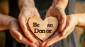United for Organ Donation. Multiple hands form a circle around a heart-shaped cushion with & x22;Be an Organ Donor& x22; text