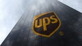 United Parcel Service UPS logo on a skyscraper facade reflecting clouds. Editorial 3D rendering Royalty Free Stock Photo