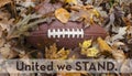 United we stand for the national anthem at football game Royalty Free Stock Photo