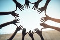 United we stand, and united we should stay. Low angle shot of a group of unidentifiable people forming a circle with Royalty Free Stock Photo