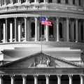 United State Capitol Building With American Flag Flying in Breeze Royalty Free Stock Photo