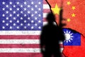 United States of America, China and Taiwan  flags painted on the concrete wall with soldier shadow. Royalty Free Stock Photo