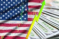 United States of America flag and chart growing US dollar position with a fan of dollar bills Royalty Free Stock Photo