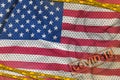 United States of America flag and Covid-19 biohazard symbol with quarantine orange tape and stamp. Coronavirus or 2019-nCov virus