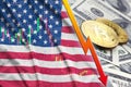 United States of America flag and cryptocurrency falling trend with two bitcoins on dollar bills Royalty Free Stock Photo