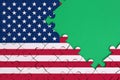 United States of America flag is depicted on a completed jigsaw puzzle with free green copy space on the right side