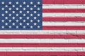 United States of America flag depicted in paint colors on old brick wall. Textured banner on big brick wall masonry background Royalty Free Stock Photo