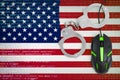 United States of America flag and handcuffed computer mouse. Combating computer crime, hackers and piracy