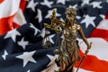 United States of America, statue of Lady Justice with USA flag Royalty Free Stock Photo