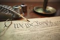 United States Constitution with quill, glasses and candle holder Royalty Free Stock Photo