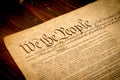 The United States Constitution on a wooden desk