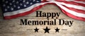 United States flag with happy memorial day message placed on wooden background. 3d illustration Royalty Free Stock Photo