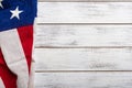 American flag on a white worn wooden background with copy space Royalty Free Stock Photo