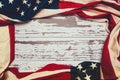 American flag on a white worn wooden background with copy space Royalty Free Stock Photo