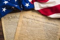 United States founding documents on a vintage American flag Royalty Free Stock Photo