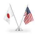 United States and Japan table flags isolated on white 3D rendering Royalty Free Stock Photo