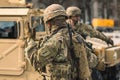 United States Marine Corps soldiers with weapons, helmets and armored vehicle humvee