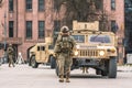 United States Marine Corps soldiers with weapons, helmets and armored vehicles humvee