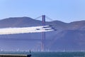 United States Navy Blue Angels aerobatic team's F-18 Hornet combat jets in flight over Golden Gate Bridge, San Francisco