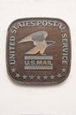 United states postal service USPS metallic sign on a wall