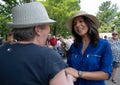 U.S. Rep. Tulsi Gabbard shakes hands during the July 4 parade in Amherst, New Hampshire, USA, on July 4, 2019