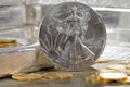 United States Silver Eagle with Gold coins & silver bars in background Royalty Free Stock Photo