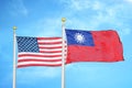 United States and Taiwan two flags on flagpoles and blue cloudy sky