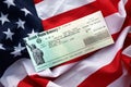 United States Treasury Refund check on waving American Flag Royalty Free Stock Photo