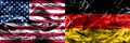United States vs Germany smoke flags concept placed side by side
