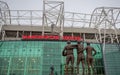 United Trinity facing the Sir Matt Busby at Old Trafford